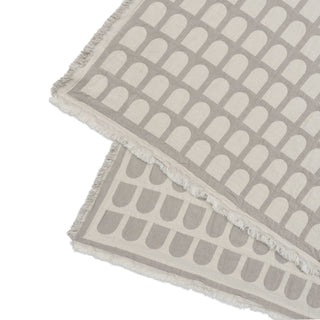 Kristina Dam Studio Arch Bedspread Two gray and white patterned towels stacked on a white background